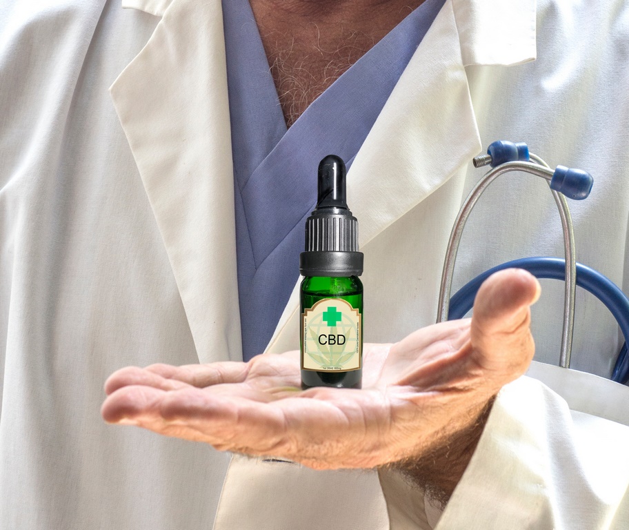 close up of Doctor holding CDB bottle