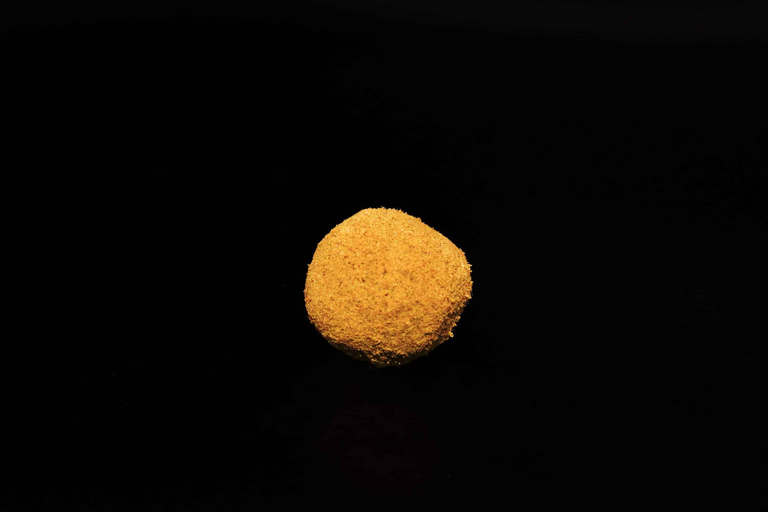 CBD hash rock single black background (Hurcann.com)